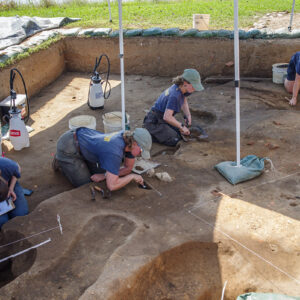 Staff Archaeologist Natalie Reid, Archaeological Field Technician Eleanor Robb, Staff Archaeologist Ren Willis, and Staff Archaeologist Caitlin Delmas conduct excavations in the 1607 Burial Ground.