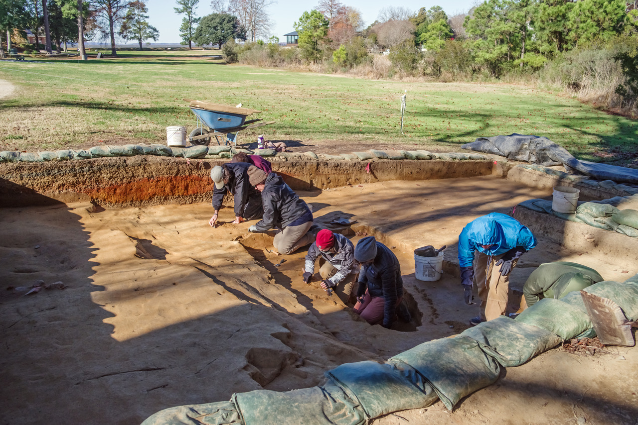 The Jamestown Rediscovery team works to clean the "burial" site for record photography.