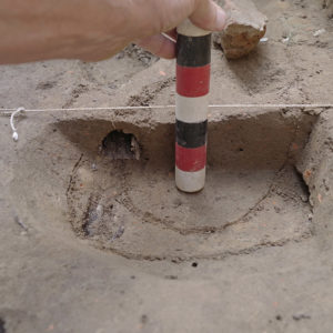 Measuring and recording a bisected feature in the north Church Tower excavations.