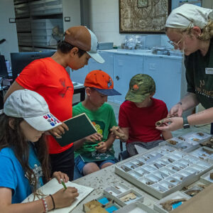 Assistant Curator Magen Hodapp shows campers how to identify common bones in the Jamestown collection.