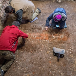 Archaeologists excavate in brick church tower