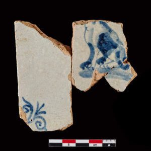 Tile with central figure of an animal, possibly a dog