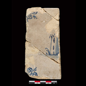 Tile with central depiction of a landscape