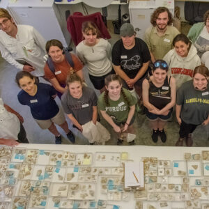 Senior Curator Leah Stricker and the field school students stand in front of the Jamestown collection of delft tiles. This is the "before" photo as the students will be mending these sherds to create more complete tiles as part of their curatorial duties. An "after" photo of the students and the tiles will be taken near the conclusion of the field school.