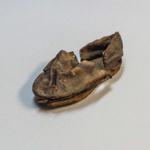 A child's shoe found in the fort's second well