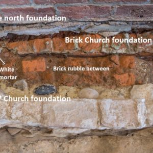 Notated brick and mortar showing divide between two foundations