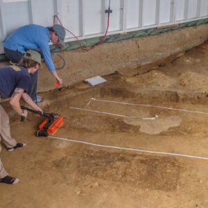 Staff Archaeologists Ren Willis and Natalie Reid conduct a GPR survey of burial JR1454.