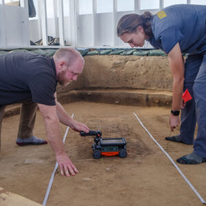 Director of Archaeology Sean Romo and Senior Staff Archaeologist Anna Shackelford conduct a ground-penetrating radar survey of JR1486.