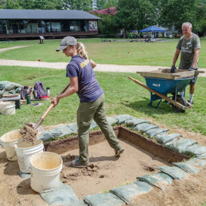 Archaeological Field Technician Katie Griffith digs and volunteer Patrick Shaver screens at the boring location near the Dale House.