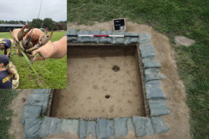 An overview of the 5'x5' excavation square that was dug to prepare for boring. The round scored circles are old crayfish burrows. A live crayfish was found in the open burrow at bottom. Opon questioning, he declared it a witch hunt.