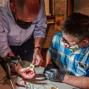 Director of Collections & Conservation Michael Lavin and Conservator Dr. Chris Wilkins work on a mount for an ivory sundial that will be included in the "Gentleman Soldiers" exhibit