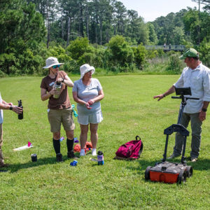 Director of Archaeology David Givens teaches Field School students how to use the GPR.