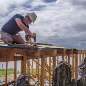 Staff Archaeologist Gabriel Brown builds the burial structure at the 1607 burial ground.