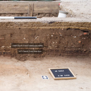 Cross section of the west Church Tower excavations showing the burn layer from the Bacon's Rebellion fire and the new 1680s Church Tower construction rubble just above it.