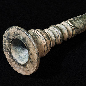 Rounded end and shank of a copper alloy trumpet