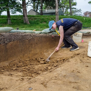 Staff Archaeologist Natalie Reid excavates a portion of the 1608 ditch.