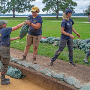 The archaeological team works to protect the excavations south of the Archaearium as Hurricane Erin gets closer.