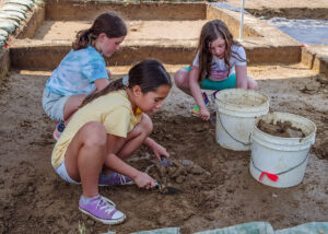 Campers excavating one of the squares in the borrow pit area.