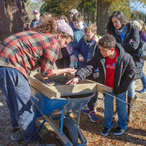 Archaeological Field Technician Josh Barber shares some of the artifacts found while screening soil from the excavations just outside the Church Tower.
