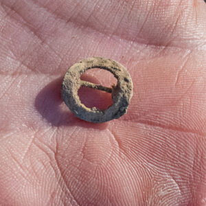 An early twentieth-century copper-alloy pin or brooch found in the excavations just outside the Church Tower