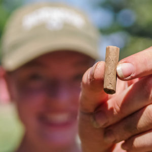 Field School studenField School student Mandy Porter holds a piece of a Robert Cotton pipe found in the north Church Tower dig.t Mandy Porter holds a piece of a Robert Cotton pipe found in the north Church Tower dig.