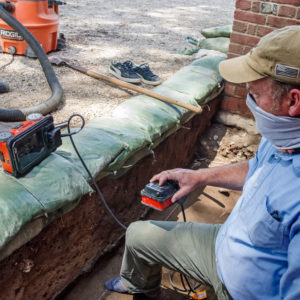 Archaeologist calibrating a GPR unit