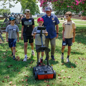 Director of Archaeology David Givens instructs campers on conducting ground-penetrating radar (GPR) surveys.