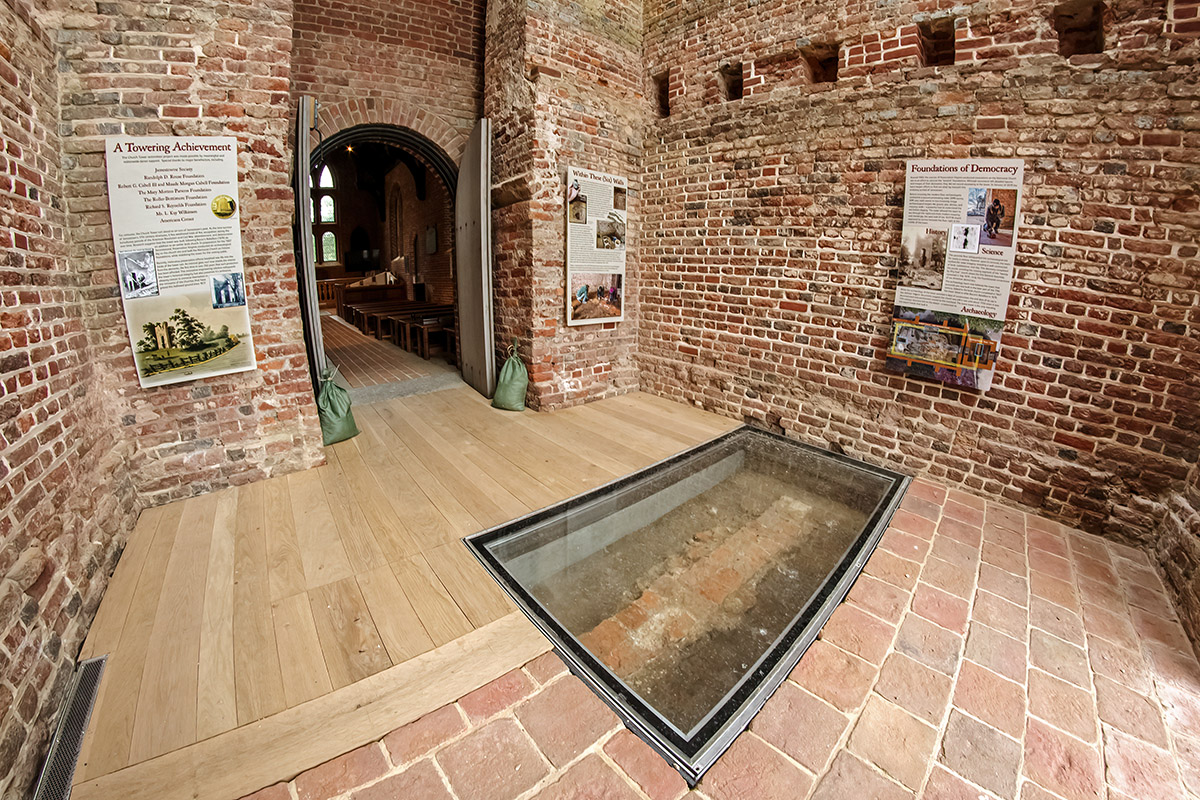 The church tower interior complete with glass portal to the 1617 church foundations and new signage.