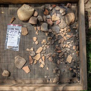 Some of the artifacts found in the 1608 ditch near the well. Several sherds of Virginia Indian pottery can be seen along with various lithics.