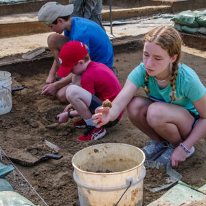 Campers conducting excavations at the clay borrow pit.