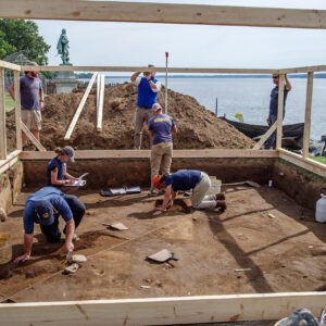 The archaeological team split time between excavating and building the burial structure.
