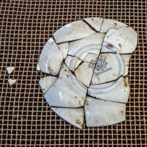 A whiteware plate that was discovered and pieced together by the campers on the last day of Kids Camp. The plate dates to the mid-nineteenth century at the earliest.