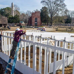 Archaeological Field Technicians Hannah Barch and Eleanor Robb and Senior Staff Archaeologist Anna Shackelford disassemble the burial structure in the 1607 Burial Ground.