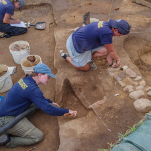 Archaeological Field Technician Katie Griffith and Staff Archaeologists Natalie Reid and Caitlin Delmas conduct excavations at the 1607 Burial Ground.