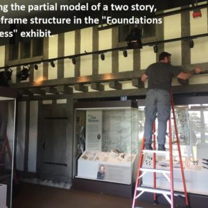 Worker installs new museum panels