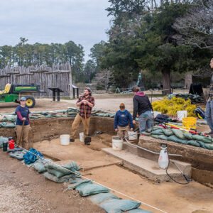 The archaeological team discusses the excavations west of the Church Tower.