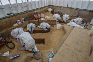 The team at work in the 1607 Burial Ground. Human remains have been digitally removed from the photo.