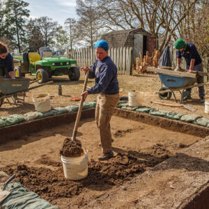 Archaeological Field Technician Hannah Barch and Staff Archaeologists Caitlin Delmas and Gabriel Brown at the Godspeed Cottage excavations