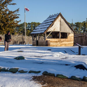 Archaeological Field Technicians Josh Barber and Hannah Barch examine the condition of the covered Kitchen/Cellar archaeological site after a snowstorm.