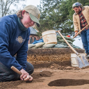 Archaeological Field Technicians Eleanor Robb and Josh Barber at work in the North Church excavations.