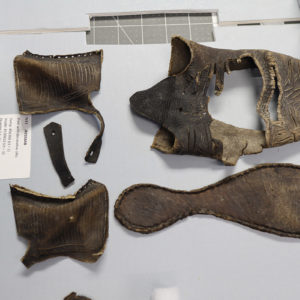 Pieces belonging to the same shoe found in the fort's second well.
