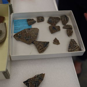 A sherd of a Bartmann jug (bottom) found in the north Church Tower dig that belongs to a partial vessel already in the collection. The medallion on the jug is the Coat of Arms of Duchy of Julich Cleve Berg Mark Ravensburg. This is a common medallion in the Jamestown Rediscovery Collection.