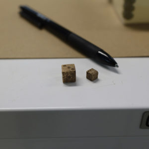 Two bone dice found in the north Church Tower excavations. These have concave numbers. Over 80 dice have been found in and around James Fort.