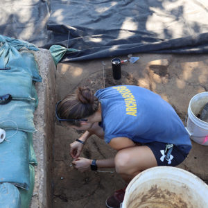 Field Supervisor Anna Shackelford prepares a feature for bisecting.