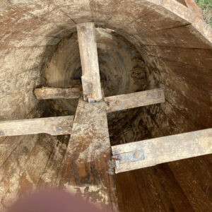 The wooden blades inside the pug mill's mixer