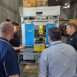 Pinnacle's Justin Rickter demonstrates a robotically-assisted X-ray machine being manufactured by Pinnacle X-Ray Solutions.
