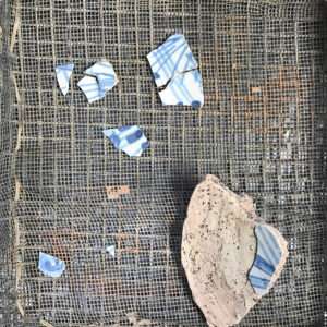 Sherds of a dish found in the Governor's Well, likely Delftware from either the Netherlands or England.