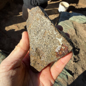 The interior surface of the melting jar sherd contains residues from materials heated inside it.