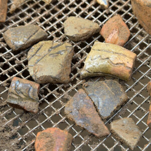 A closeup of sgraffito ceramics found in North Church excavations this month