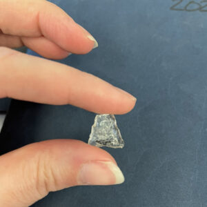 A crystal clear quartz small triangular point recently cataloged by the curatorial team.